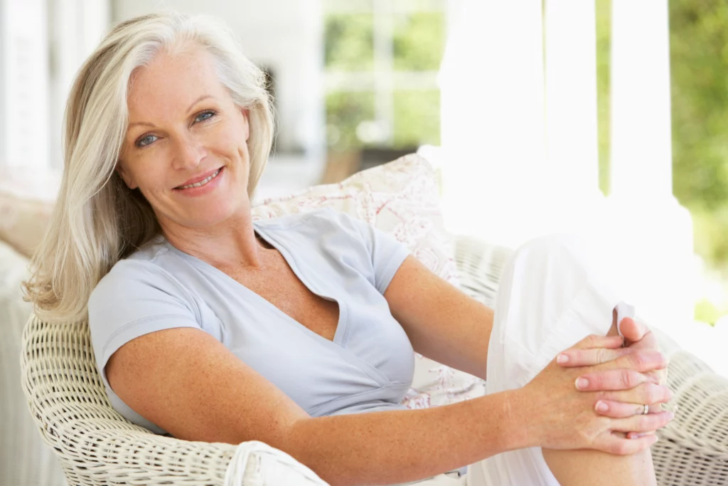 senior smiling woman posing while sitting